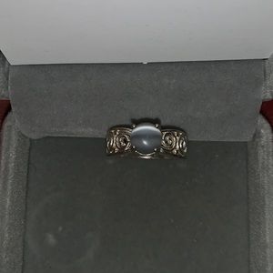 silver ring with a pearlescent colored stone